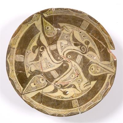 Lot 668 - A Persian slip-decorated bowl