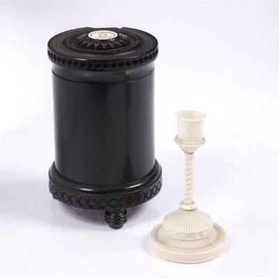 Lot 690 - An Indian ebony cylindrical box with ivory inset cover