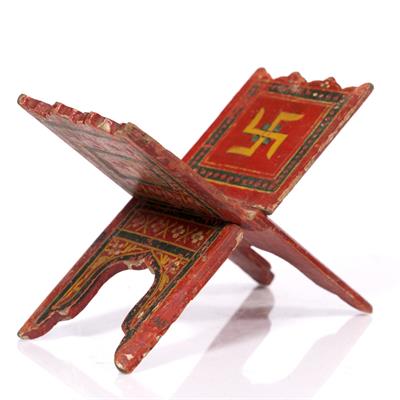 Lot 695 - An Indian polychrome painted manuscript stand