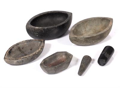 Lot 702 - A collection of Mughal black marble pestles and mortars