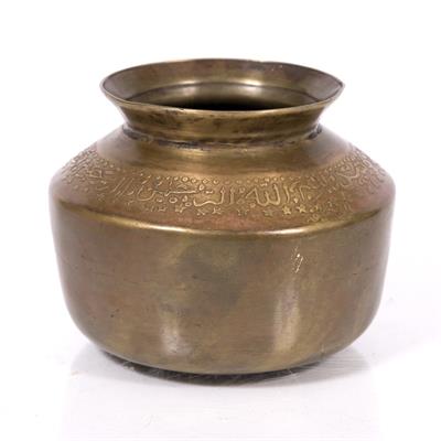 Lot 713 - An Islamic brass pot