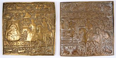 Lot 731 - A pair of Qajar embossed brass panels