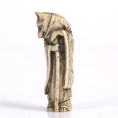 Lot 765 - A Japanese ivory netsuke of a standing Fox Priest