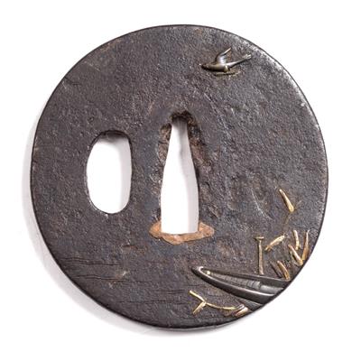 Lot 771 - A Japanese iron tsuba