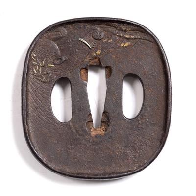 Lot 774 - A Japanese iron tsuba