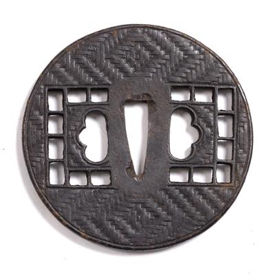 Lot 776 - A Japanese iron tsuba