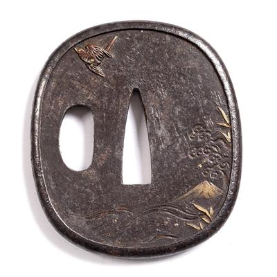 Lot 780 - A Japanese iron tsuba