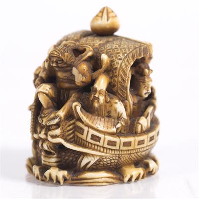 Lot 790 - A Japanese ivory okimono netsuke carved as the Shichifukin