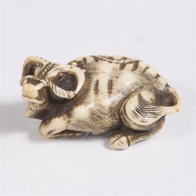 Lot 796 - A Japanese bone netsuke of a reclining ox