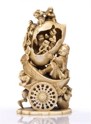 Lot 944 - A Japanese ivory okimono carved as a museulam oni pulling a bird