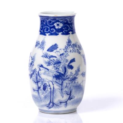 Lot 947 - A small Japanese Imari blue and white porcelain vase