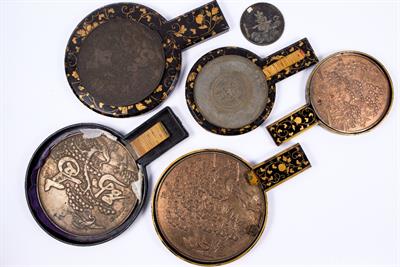 Lot 951 - Five Japanese bronze hand mirrors