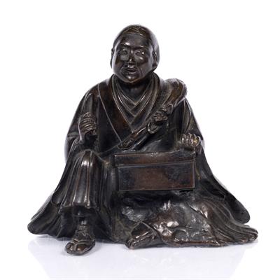 Lot 955 - A Japanese bronze model of a seated priest