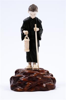 Lot 958 - A Japanese bronze and ivory figure of a standing elderly lady