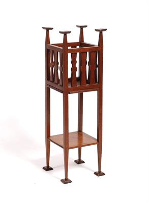 Lot 16 - An Arts and Crafts stained oak jardiniere stand