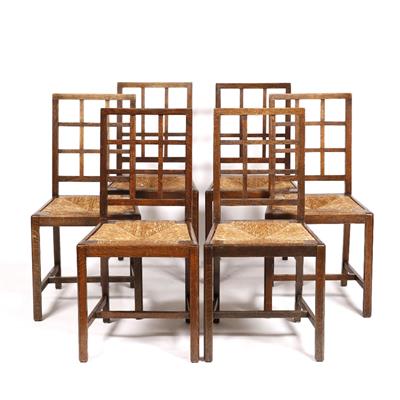 Lot 17 - A set of six Heals oak dining chairs