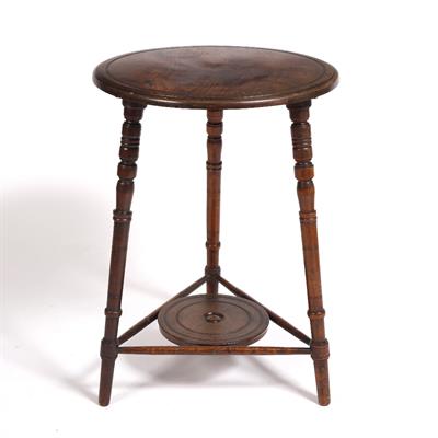 Lot 23 - An Aesthetic walnut circular occasional table
