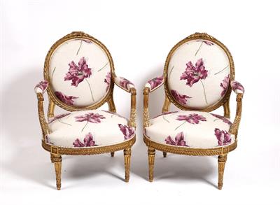 Lot 31 - A pair of French gilt wood arm chairs