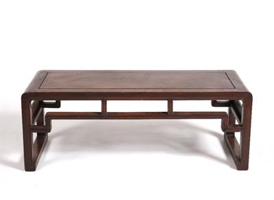 Lot 34 - A Chinese hard wood low table