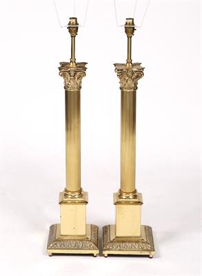 Lot 114 - A pair of brass Corinthian table lamps
