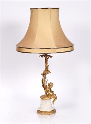 Lot 119 - A gilt metal and onyx cherub table lamp and shade