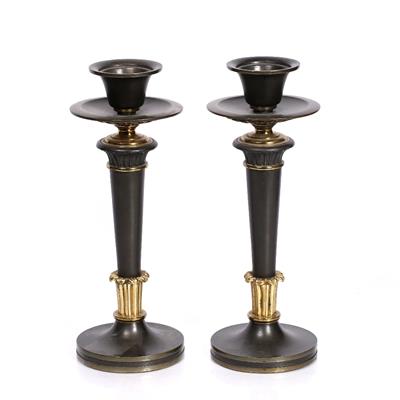 Lot 250 - A pair of William IV bronze and gilt candlesticks