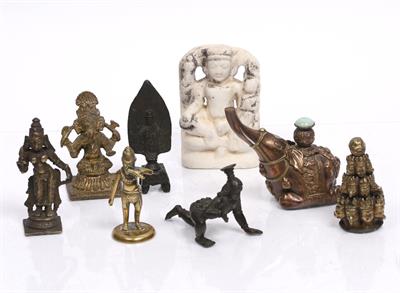 Lot 360 - A Tibetan gilt metal group of ceremonial heads