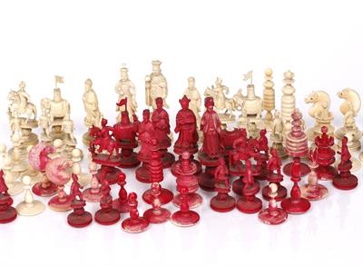 Lot 380 - A Chinese carved and stained ivory chess set