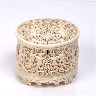 Lot 391 - A Singalese carved ivory oval box