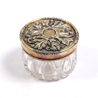 Lot 485 - A glass jar with silver gilt mounted neck and lid