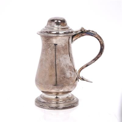 Lot 492 - An 18th Century silver plated lidded tankard