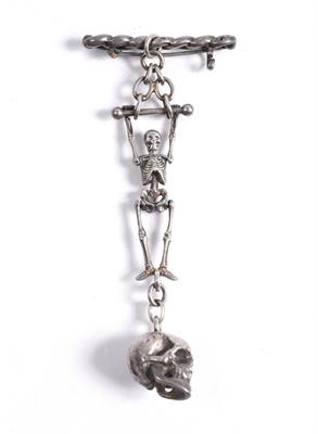 Lot 499 - A pendant in the form of a skeleton trapeze artist