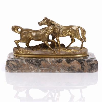 Lot 513 - A small gilt bronze model of two horses