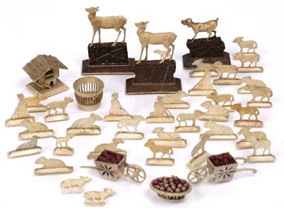 Lot 514 - An Austrian miniature bone carved set of garden figures