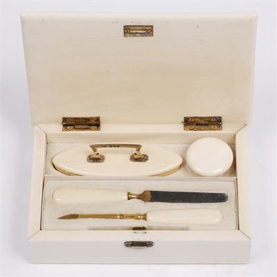 Lot 520 - An ivory and silver gilt manicure set