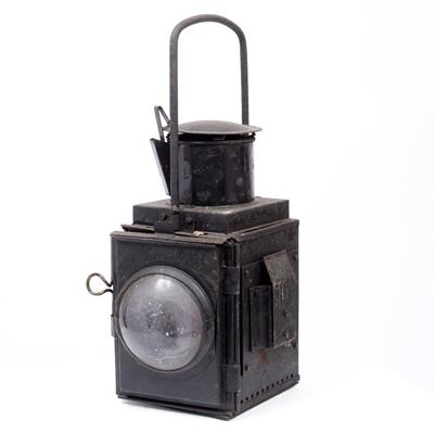 Lot 122 - A 20TH CENTURY BLACK PAINTED RAILWAY HAND HELD LANTERN OR LOCOMOTIVE HEADLAMP