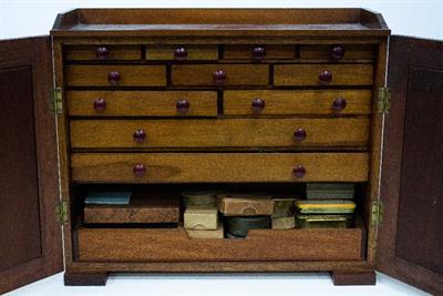 Lot 400 - A MAHOGANY WATCHMAKERS CABINET