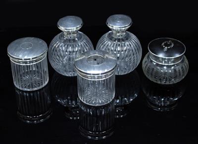 Lot 430 - A GROUP OF FOUR MATCHING CUT GLASS SILVER TOPPED DRESSING TABLE JARS