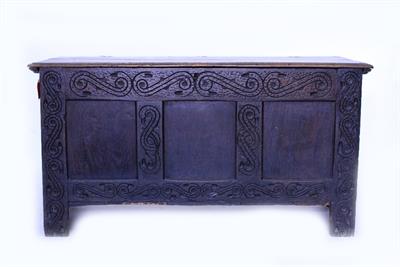 Lot 573 - AN 18TH CENTURY CARVED OAK COFFER