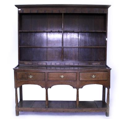 Lot 753 - A GEORGE III AND LATER OAK DRESSER