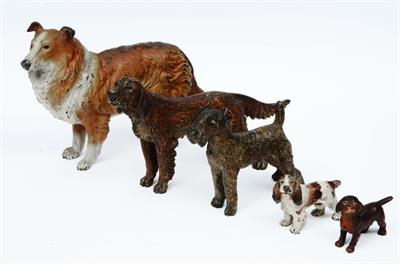 Lot 7 - A PACK OF FIVE BRONZE COLD PAINTED DOGS in the Bergman style comprising a Collie