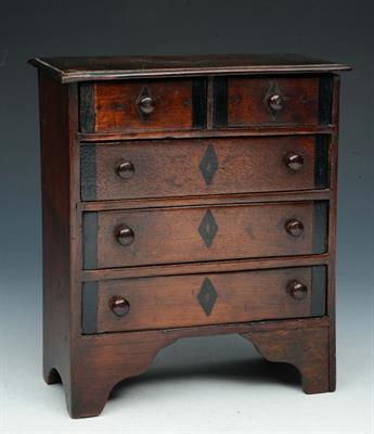 Lot 16 - AN APPRENTICE MINIATURE MAHOGANY CHEST of two short and three long drawers with inlaid decoration