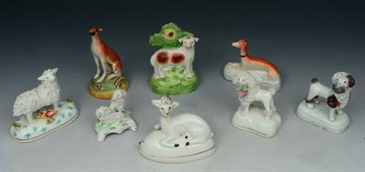 Lot 36 - A GROUP OF EIGHT STAFFORDSHIRE POLYCHROME POTTERY MODELS of dogs/deer/sheep