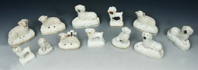 Lot 37 - A GROUP OF TWELVE STAFFORDSHIRE WHITE GLAZED MODELS of dogs and sheep