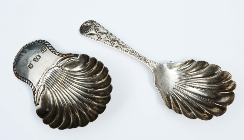 Lot 38 - A GEORGE III SILVER CADDY SPOON with a shell shaped bowl and gadrooned handle