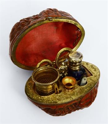 Lot 61 - A FRENCH WALNUT SHELL AND GILT ETUI with fitted interior and engraved decoration