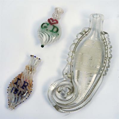 Lot 69 - A GLASS SCENT BOTTLE of sea horse form with engraved sailing ship and inscribed Mary Ryman