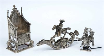 Lot 97 - A MINIATURE SILVER THRONE standing on four seated lions