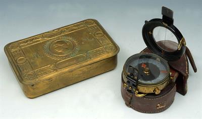 Lot 109 - A WWI POCKET COMPASS in leather case and a WWI Christmas 1914 brass tobacco box (2)