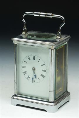 Lot 116 - A SILVERED CASED CARRIAGE CLOCK with swing handle and white enamel dial